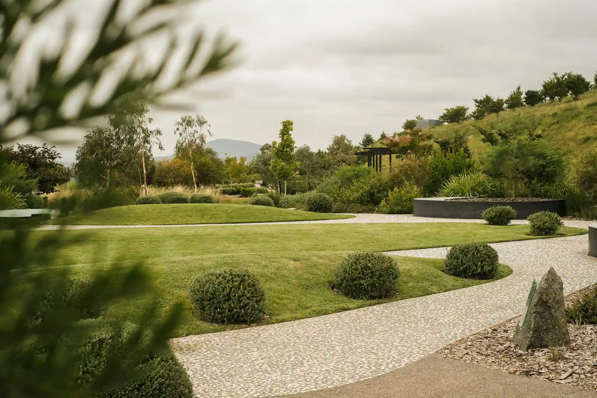 Sod laying & lawn restoration Pathway & stepping stone setups Garden fencing, lighting & water features Retaining walls & pebble laying